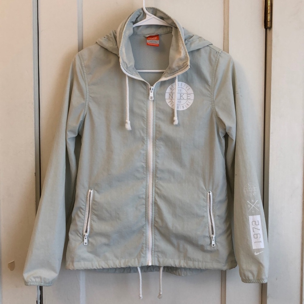 Nike mint green color rain coat.